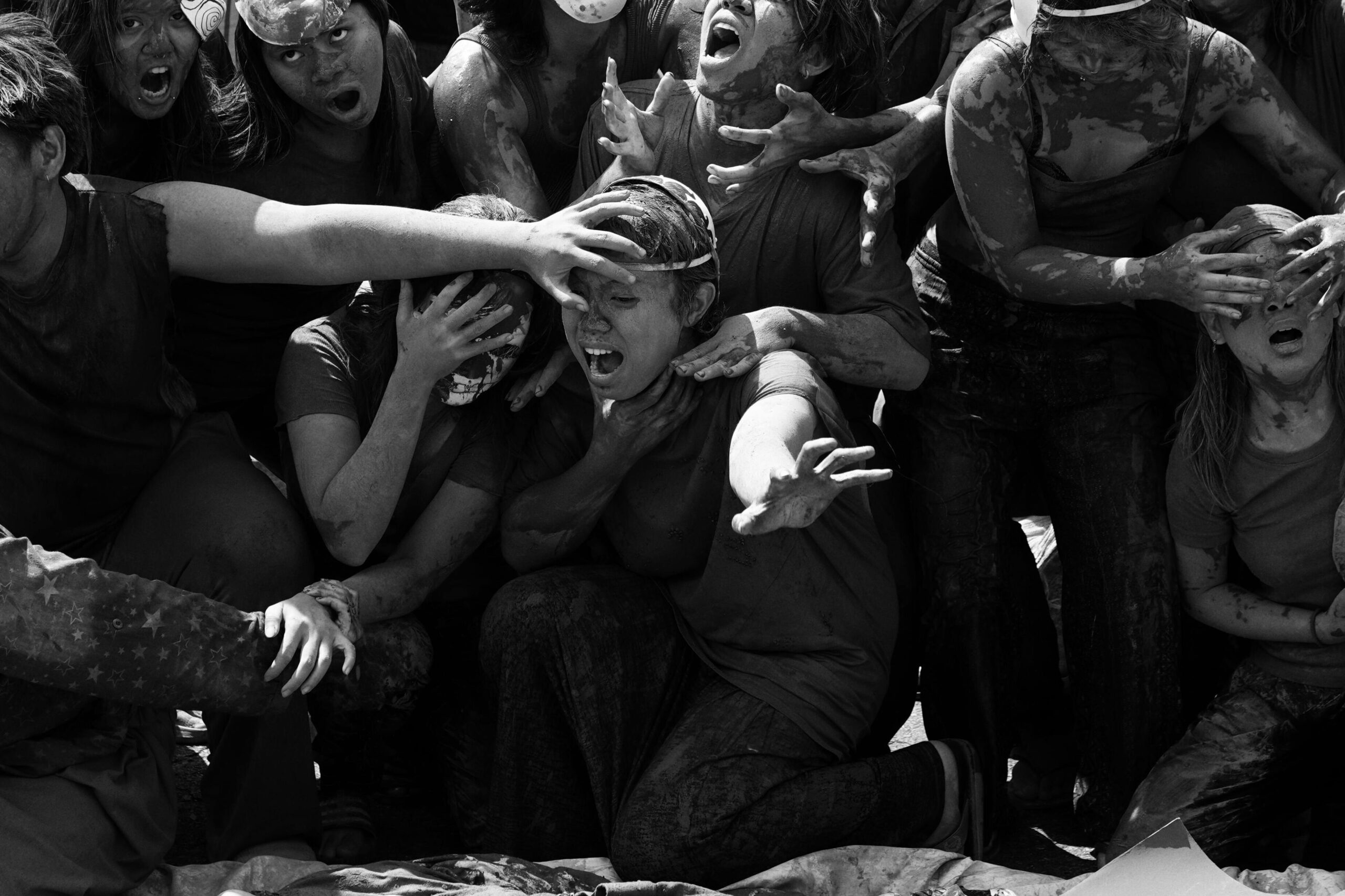 Vivid scene of protesters expressing emotion during a dynamic street demonstration.